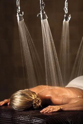 Warm water falling from a six head Vichy rain shower